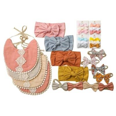 Soft pastel-colored baby headbands and hair accessories with bows, lace details, and decorative embellishments, perfect for infants and toddlers.