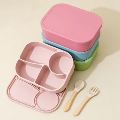 Colorful eco-friendly kids' lunchboxes with compartments and matching utensils for healthy meal storage, ideal for school or daycare. Stylish and practical lunch containers for children.