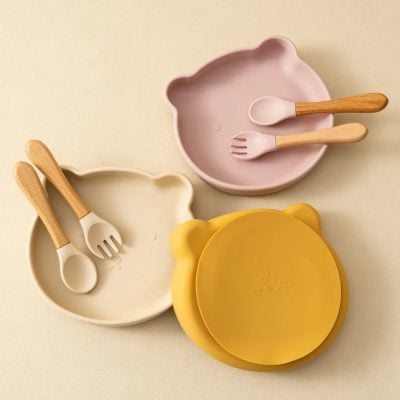 Bear-shaped silicone plates with matching bamboo utensil sets for kids, available at Monalisa Store. Perfect for children's dining, combining fun design with durable, eco-friendly materials.