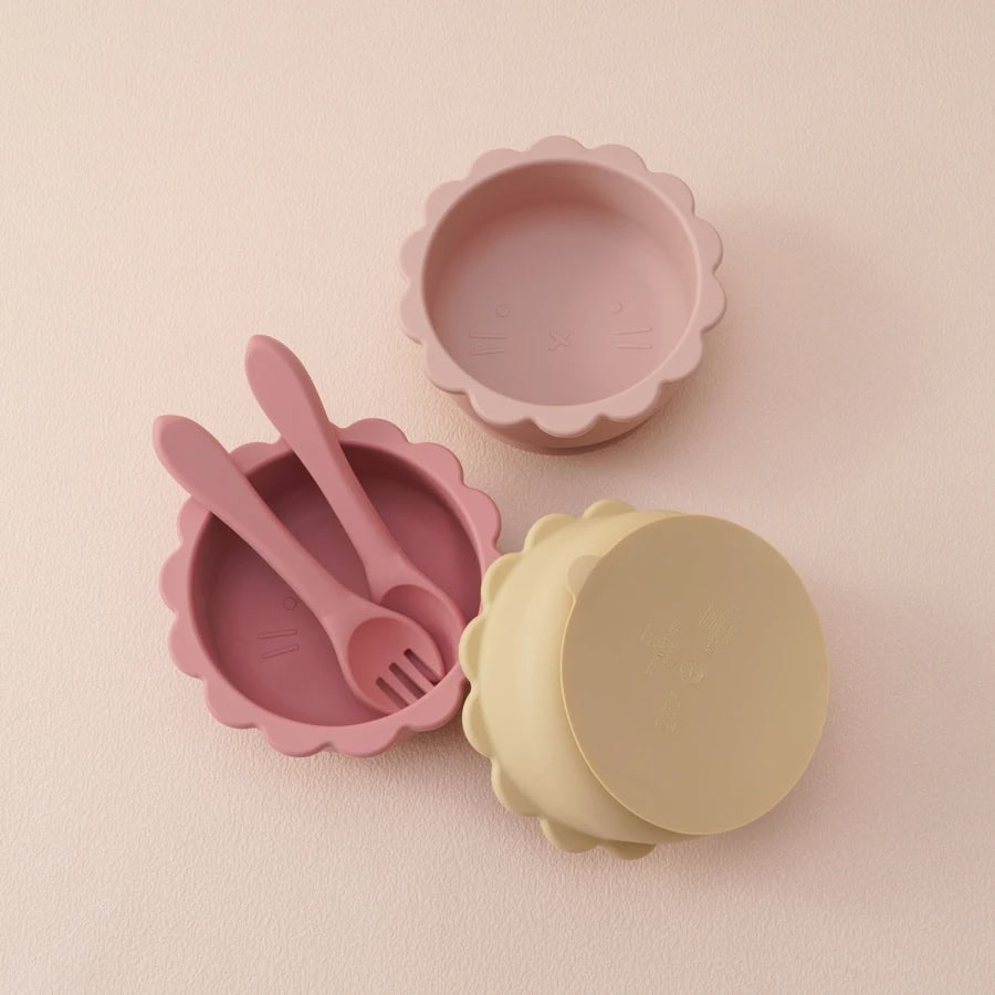 Pink bunny silicone bowl with utensils, pastel yellow bear-shaped storage container for kids, and soft pink and yellow food containers from Monalisa Store, perfect for children's mealtime and storage needs.