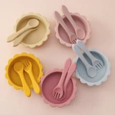 Silicone baby bowls with matching spoons and forks in pastel colors, ideal for infant feeding and toddler meals, available at Monalisa Store.