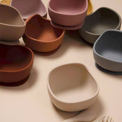 Colorful ceramic bowls in soft pastel shades, perfect for stylish serving and kitchen decor. Various shapes and colors add a modern touch for home or restaurant use.