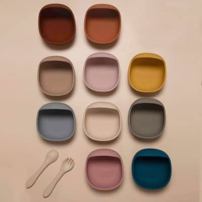 Square ceramic dishes in various pastel and earthy colors with matching spoons, ideal for food presentation or decorative purposes.