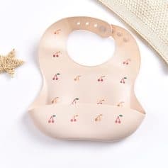 Cherry-patterned silicone baby bib for infant feeding and teething. Stylish, soft, and easy to clean, perfect for nurseries and mealtime essentials. Ideal for parents seeking quality baby accessories.