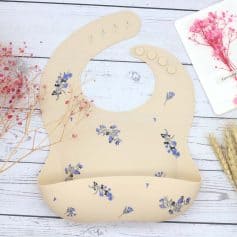 Soft silicone baby bib with floral design, adjustable neck, easy-to-clean, perfect for feeding time, stylish and functional accessory for babies.