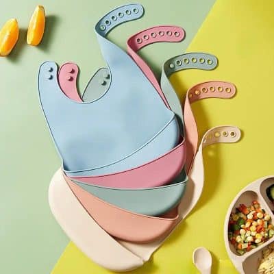Mealtime baby bibs stack, silicone bibs for infants, colorful toddler feeding bibs, soft eat bibs with adjustable straps, versatile baby feeding accessories.