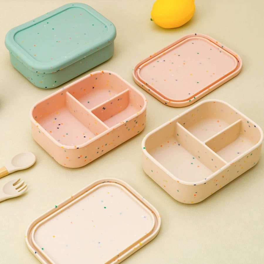 Colorful speckled bento lunch boxes with divided compartments, perfect for kids and school lunches. Bright pastel colors and fun design from Monalisa Store.