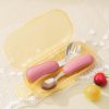 Soft pink baby utensils set with a matching case, ideal for infant feeding and travel, designed for convenience and safety, featuring stainless steel spoon and fork.