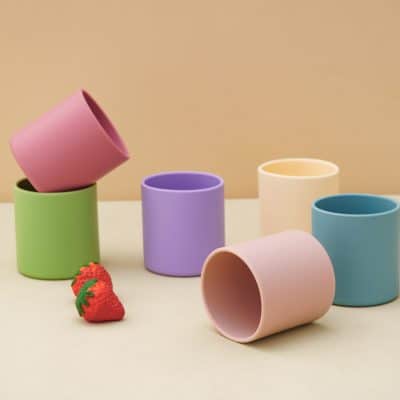 Colorful silicone cups for trendy drinking accessories and home decor, featuring pastel shades of pink, purple, yellow, green, and blue, ideal for modern lifestyle and gift purposes.