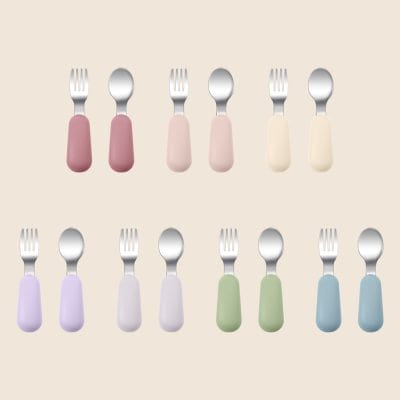 Pink, purple, green, blue, and white colorful baby utensils set on beige background, safe and BPA-free for Newborns, toddlers, and children, quality kitchen cutlery for kids.