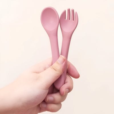 Pink plastic spoon and fork set held in hand, suitable for medical or cosmetic use, easy to handle and hygienic, ideal for skincare treatments at Monalisa Store.