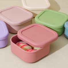 Colorful silicone food storage containers in pastel pink, green, purple, and blue, designed for preserving and organizing snacks and meals, ideal for kitchen and travel use.
