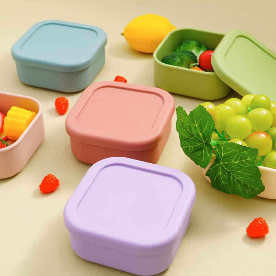 Colorful food storage containers with fresh fruits and vegetables, ideal for healthy meal prep and organization at Monalisa Store.