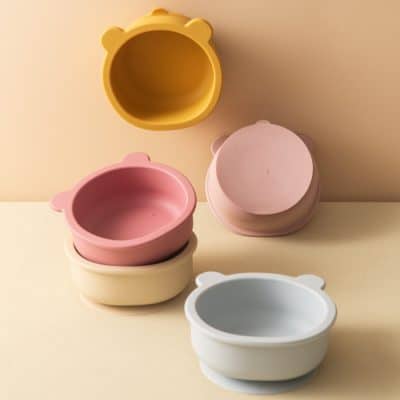 Colorful bear-shaped silicone storage containers in pastel pink, yellow, white, and gray, ideal for organizing small items or snacks, featuring a cute bear ear design at Monalisa Store.