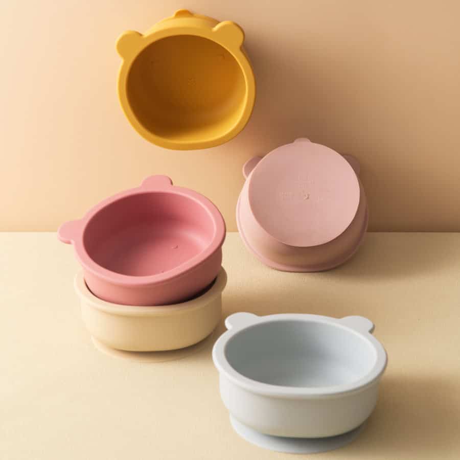Colorful bear-shaped silicone storage containers in pastel pink, yellow, white, and gray, ideal for organizing small items or snacks, featuring a cute bear ear design at Monalisa Store.