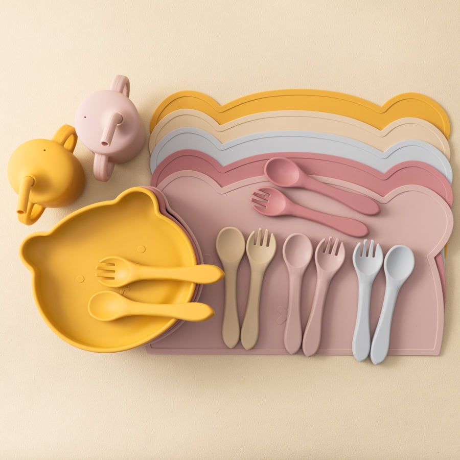 Colorful silicone baby dining set with bowls, plates, spoons, forks, and cutlery organizers, ideal for kids learning to eat and develop independence. Perfect for feeding and meal times.