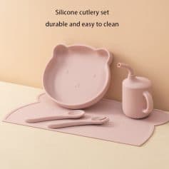 Silicone children's dinnerware set with bear-shaped bowl, spoon, fork, and cup for easy cleaning and durability.