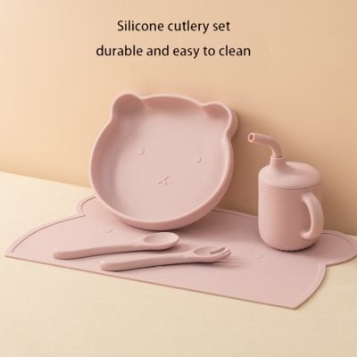 Silicone children's dinnerware set with bear-shaped bowl, spoon, fork, and cup for easy cleaning and durability.