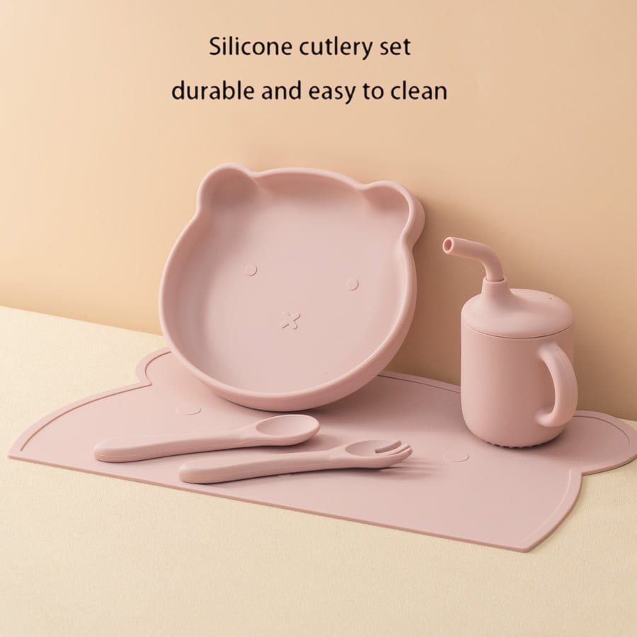 Silicone children's dinnerware set with bear-shaped bowl, spoon, fork, and cup for easy cleaning and durability.