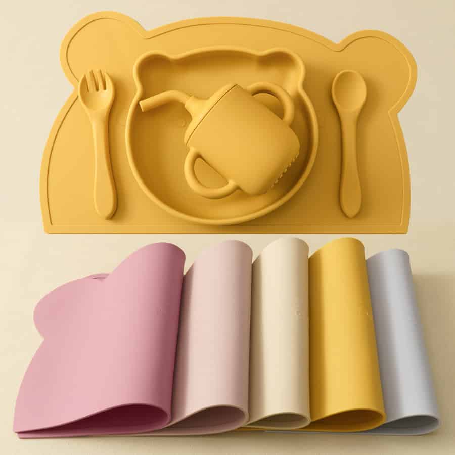 Colorful silicone children’s dinnerware set with plate, cup, fork, and spoon, suitable for kids meal times and safe for children.