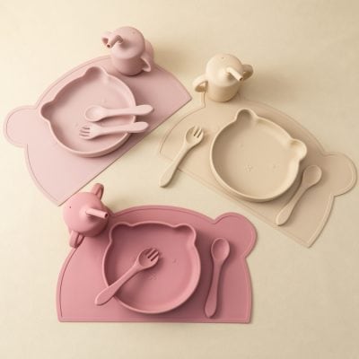 Bright pink and cream bear-shaped silicone dinnerware sets with matching utensils and cups, ideal for children. Durable, safe, and stylish tableware from Monalisa Store, perfect for kids' meal times and home dining.