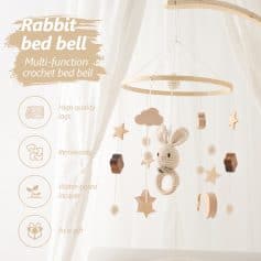 Rabbit bed bell crochet crib mobile with wooden and fabric elements, water-based lacquer finish, perfect for nurseries and baby rooms.