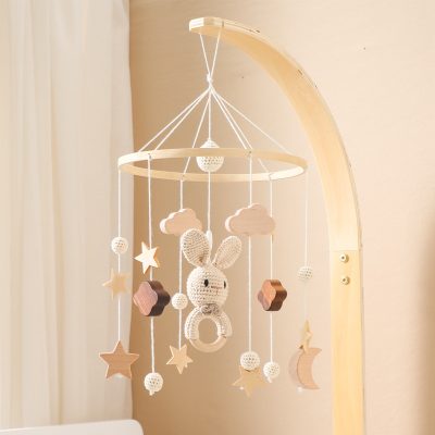 Soft pastel-colored baby mobile with cloud, star, moon, and bunny hanging decorations for nursery decor, ideal for infant comfort and sensory development.