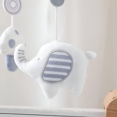 Adorable plush elephant baby mobile for nursery decor, featuring soft fabrics and striped accents, ideal for soothing infants. Perfect for creating a calming, playful environment for young children.
