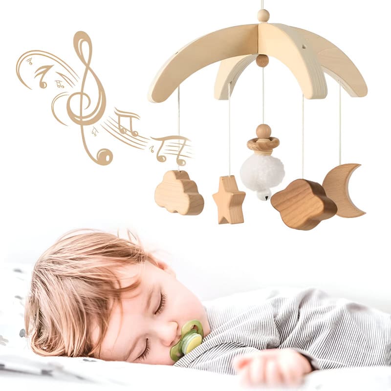 Wooden baby crib mobile with stars, clouds, moon, and musical notes for nursery decor.