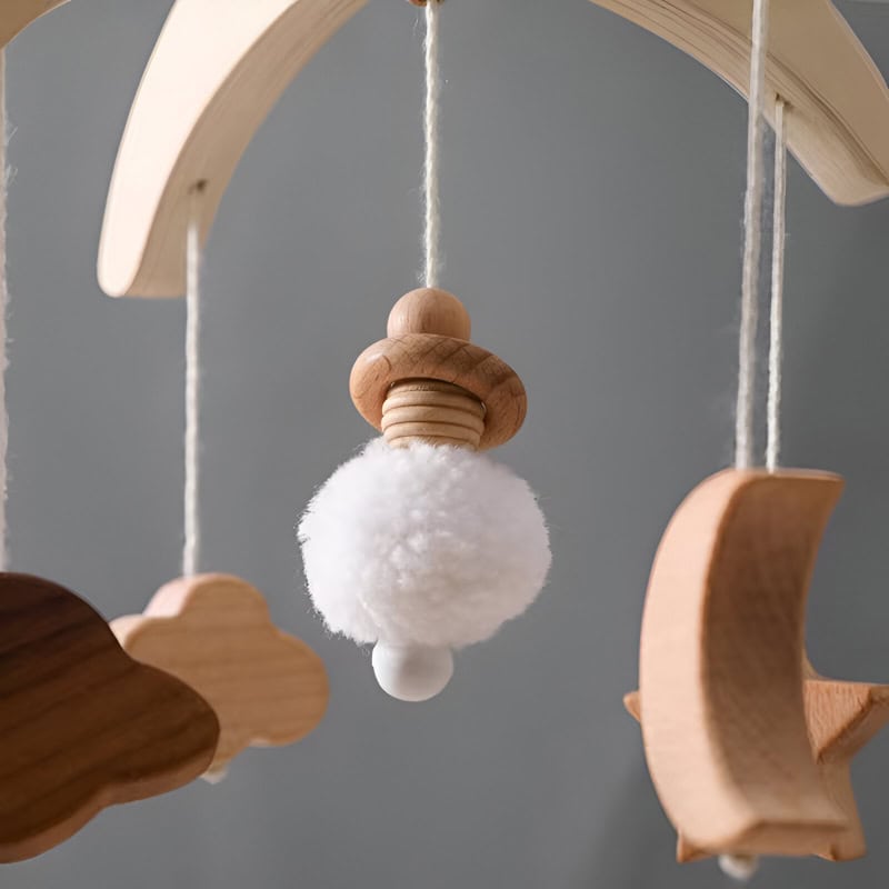 Soft baby mobile with wooden clouds, moon, and star for nursery decor, perfect for calming infants and promoting visual development, available at Monalisa Store.
