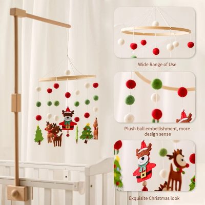 Red, white, and green felt Christmas tree mobile with reindeer and snowman adornments for nursery decoration.