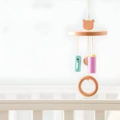 Wooden baby crib mobile with colorful beads and a bear-shaped topper, nursery baby toy, soft pastel nursery decor, modern baby shower gift, Montessori style baby accessories.