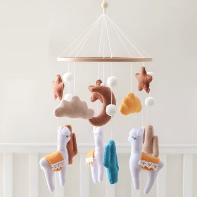 Soft baby mobile with plush clouds, stars, moons, and unicorns for nursery decoration and sensory development, featuring soothing colors and gentle designs.