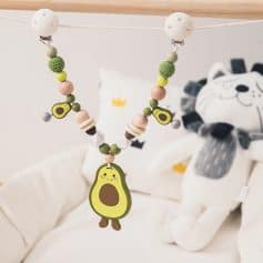 Colorful baby teething necklace with avocado charm, soft silicone beads, and eco-friendly design for infants, perfect for teething relief and nursery decor.