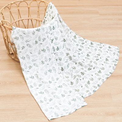 Soft white and green leafy pattern medical drape fabric displayed in a natural rattan basket, perfect for clinical and aesthetic procedures at Monalisa Store.