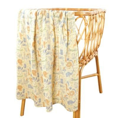 Colorful fabric cover with animal print for Monalisa Store rattan crib, home decor, and baby accessory storage solutions.