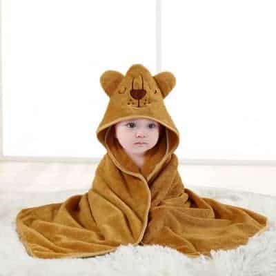 Adorable plush baby blanket with bear hood, perfect for comfort and warmth, available at Monalisa Medical Store. Ideal for baby gifts, sleepwear, and newborn essentials, combining comfort with cute design.