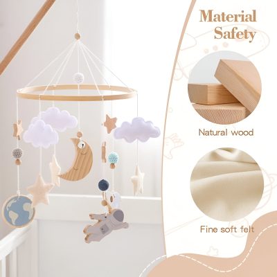 Soft pastel baby mobile with moon, clouds, stars, and earth, ideal for nursery decor, made from natural wood and soft felt materials, perfect for infants.