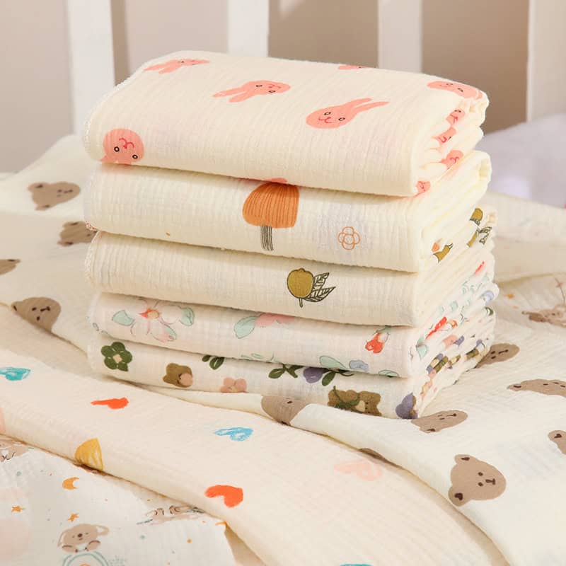 Soft baby muslin swaddles with cute animal and fruit prints for comfortable infant sleep and breastfeeding cuddle.