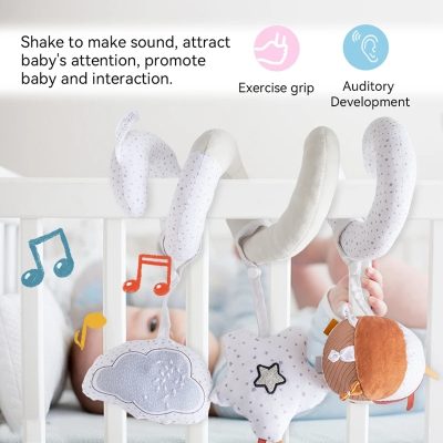 Soft baby sensory toy hanging in crib, with exercise grip and auditory development features, designed to stimulate baby’s attention and promote interaction during playtime.