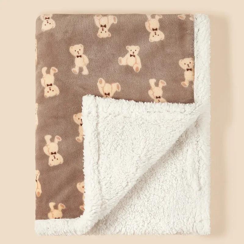 Soft plush baby blanket featuring adorable puppy patterns on the front and cozy sherpa lining on the back for warmth and comfort. Perfect for newborns and infants.