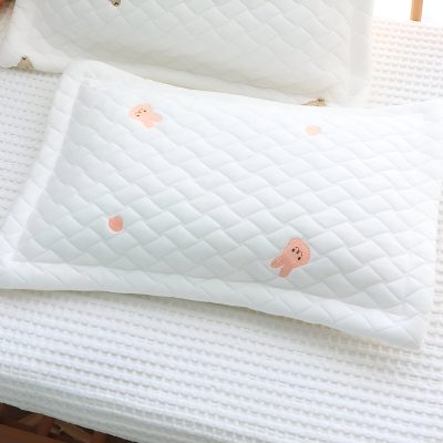 Soft white baby pillow with pink bunny embroidery, designed for comfort and support in infant sleep, perfect for nurseries, emphasizing baby sleep accessories.
