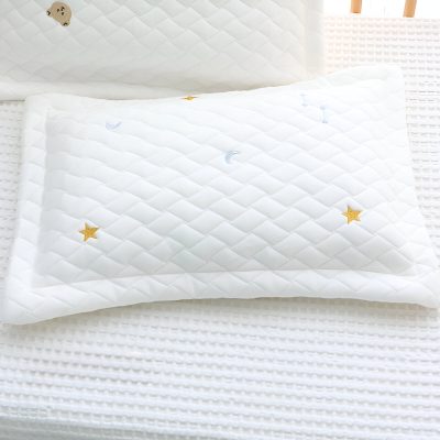Silk pillow with embroidered stars, moons, and celestial designs, perfect for restful sleep and comfort in sleep therapy and sleep disorder treatments.