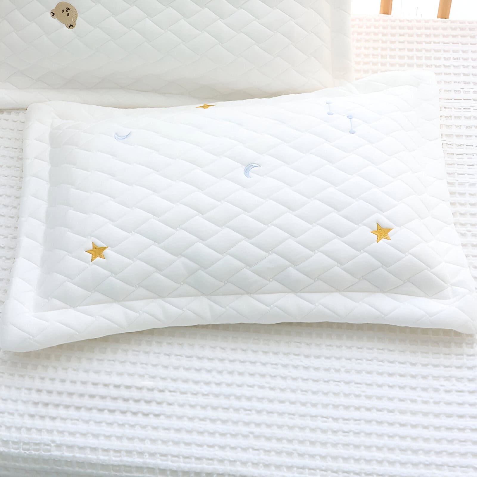 Silk pillow with embroidered stars, moons, and celestial designs, perfect for restful sleep and comfort in sleep therapy and sleep disorder treatments.