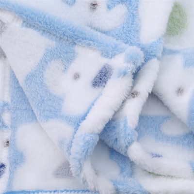 Soft plush baby blanket with pastel blue, white, and gray colors, featuring cute animal prints, ideal for keeping infants cozy and comfortable.