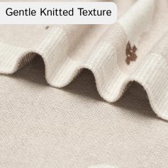 Soft beige knitted fabric with gentle texture, perfect for comfortable clothing and accessories. Premium quality material suitable for various fashion and home decor projects.