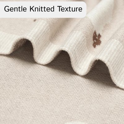 Soft beige knitted fabric with gentle texture, perfect for comfortable clothing and accessories. Premium quality material suitable for various fashion and home decor projects.
