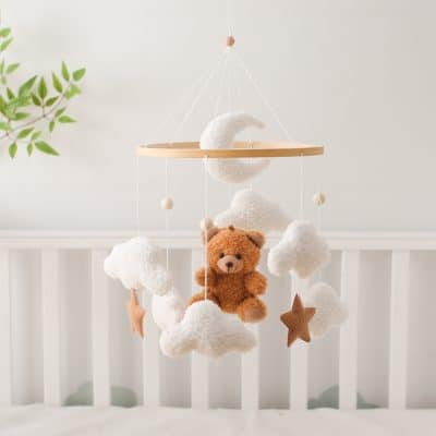 Soft baby mobile with teddy bear, clouds, star shapes, and moon for nursery decor.