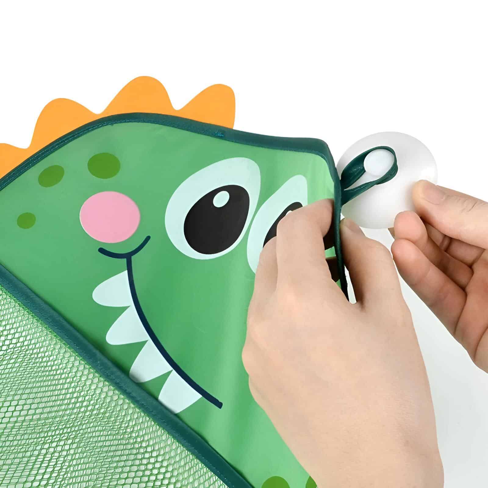 Bright green dinosaur-shaped kids’ eye patch with playful cartoon face designed for children's eye patch therapy and optometry treatments at Monalisa Store.