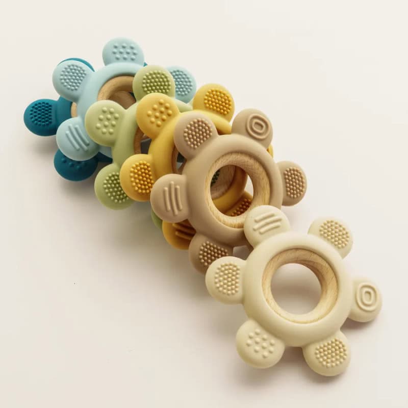 Colorful silicone baby teethers with wooden rings, soft textured for soothing gums, perfect for teething babies and infant dental care.